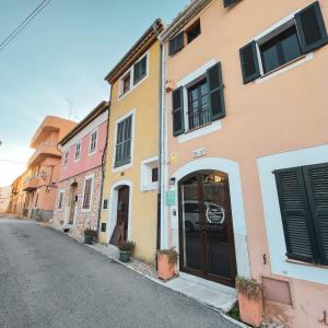 a row of buildings on the side of a street at El Nido de Alaro - Turismo de Interior in Alaró