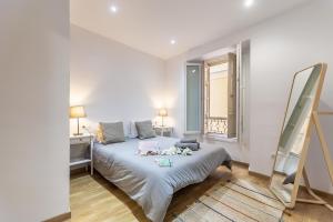 Postel nebo postele na pokoji v ubytování Boutique Mitjana Apartment