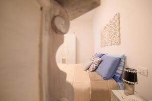 A bed or beds in a room at IL NIDO DEL FASO