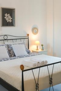 Posteľ alebo postele v izbe v ubytovaní Dahlia Apartments And Studios