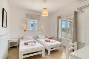 Posteľ alebo postele v izbe v ubytovaní Dahlia Apartments And Studios