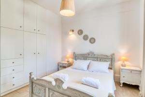 Posteľ alebo postele v izbe v ubytovaní Dahlia Apartments And Studios