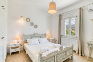Posteľ alebo postele v izbe v ubytovaní Dahlia Apartments And Studios