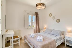 Posteľ alebo postele v izbe v ubytovaní Dahlia Apartments And Studios