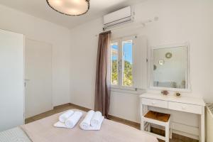 Posteľ alebo postele v izbe v ubytovaní Dahlia Apartments And Studios