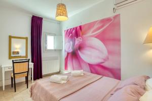 Posteľ alebo postele v izbe v ubytovaní Dahlia Apartments And Studios