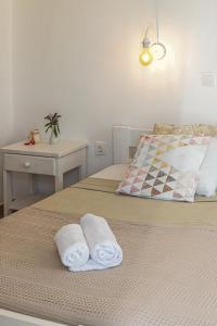 Posteľ alebo postele v izbe v ubytovaní Dahlia Apartments And Studios