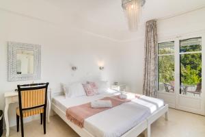 Posteľ alebo postele v izbe v ubytovaní Dahlia Apartments And Studios