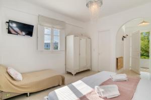 Posteľ alebo postele v izbe v ubytovaní Dahlia Apartments And Studios