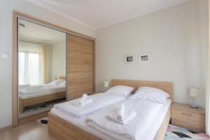Posteľ alebo postele v izbe v ubytovaní Apartament Panorama z widokiem na góry