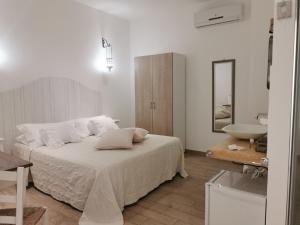 Giường trong phòng chung tại Vento d'aMare