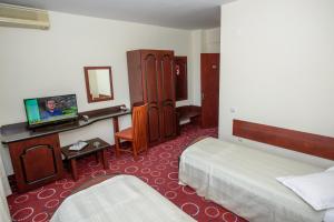 Lova arba lovos apgyvendinimo įstaigoje Hotel Scala