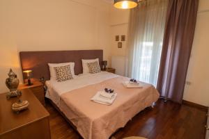 Posteľ alebo postele v izbe v ubytovaní Mouzakiaris Home Meteora View