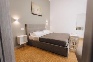 Postel nebo postele na pokoji v ubytování THE NEST - B&B - Suites