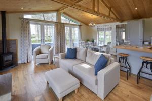a living room with a couch and a kitchen at Host & Stay - Salt & Seaweed in Runswick +12 photos