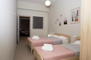 Postel nebo postele na pokoji v ubytování Giotis apartments