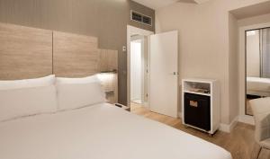 Postel nebo postele na pokoji v ubytování NH Madrid Chamberí + 29 fotografií