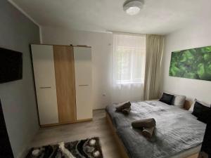 Postel nebo postele na pokoji v ubytování T&T Apartman