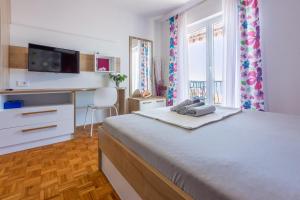 Ένα ή περισσότερα κρεβάτια σε δωμάτιο στο Apartment Mira