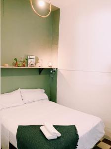 A bed or beds in a room at Maria Magdalena - Room 7
