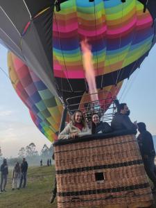 a group of people in a hot air balloon at Ecohostel Dos Canyons Santa Catarina in Praia Grande