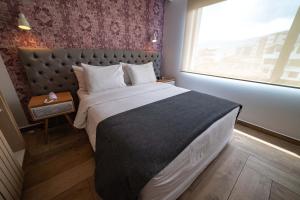Postel nebo postele na pokoji v ubytování 1460 Luxury Room KAIA - Best Place in Quito