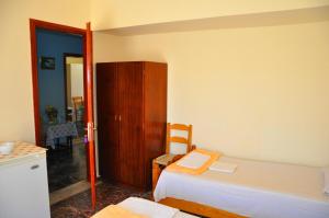 A bed or beds in a room at Vai Rent Rooms
