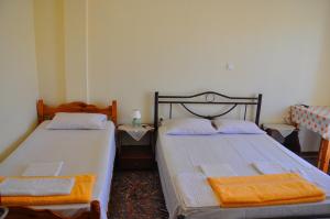 A bed or beds in a room at Vai Rent Rooms