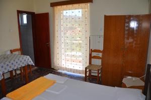 A bed or beds in a room at Vai Rent Rooms