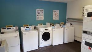 a laundry room with washers and dryers in it at InTown Suites Extended Stay Knoxville TN in Knoxville