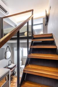 a staircase in a room with a bathroom at Heritage Collection on Seah - A Digital Hotel in Singapore