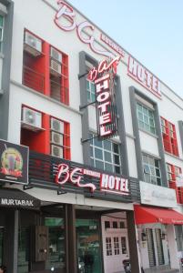 a hotel with a large sign on the front of it at BG Business Hotel in Bukit Mertajam