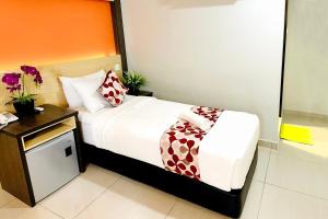 Postel nebo postele na pokoji v ubytování City Central Hotel