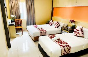 Postel nebo postele na pokoji v ubytování City Central Hotel