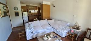 a living room with a couch and a table at R&R Eden wilds in Port Edward