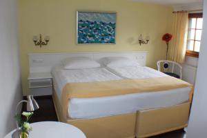 Postel nebo postele na pokoji v ubytování Hotel Das Landhaus