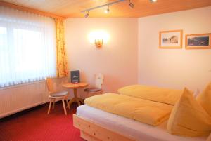 Postel nebo postele na pokoji v ubytování Haus Moostal