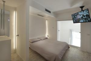 Tempat tidur dalam kamar di Luxury House Lecce -Le mie 3 Suites-