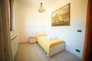 a bedroom with a bed and a painting on the wall at Villa Patrizia-Luxury Villa in Mottola +47 photos