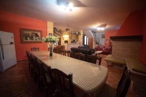 a dining room with a table and chairs and a living room at Villa Patrizia-Luxury Villa in Mottola
