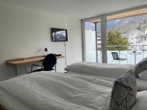 Cama o camas de una habitación en Hotel Hahnenblick