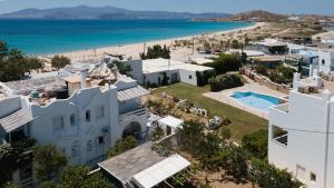 an aerial view of a house and the beach at Aqua Naxos Apartments & Suites in Naxos Chora