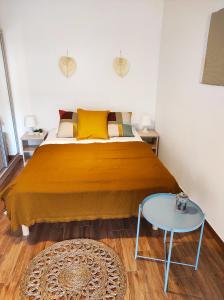 a bedroom with a large bed with a glass table at Apartament Piaskowy NR A5 (3-5 os.) in Rowy