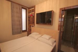 Łóżko lub łóżka w pokoju w obiekcie Hotel Vadászkürt Superior