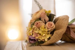 a bouquet of flowers is sitting on a table at Vecchio Granaio in Pisa