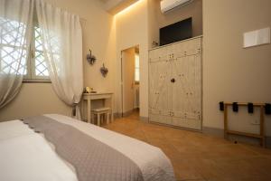 a bedroom with a bed and a sliding door at Vecchio Granaio in Pisa
