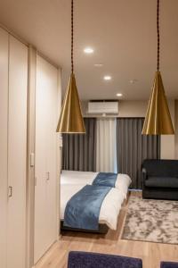 Łóżko lub łóżka w pokoju w obiekcie hotel aima
