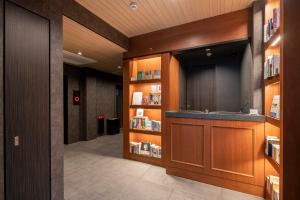 a library with a sink and a book shelf at hotel aima in Tokyo