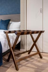 Łóżko lub łóżka w pokoju w obiekcie hotel aima