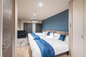 Łóżko lub łóżka w pokoju w obiekcie hotel aima